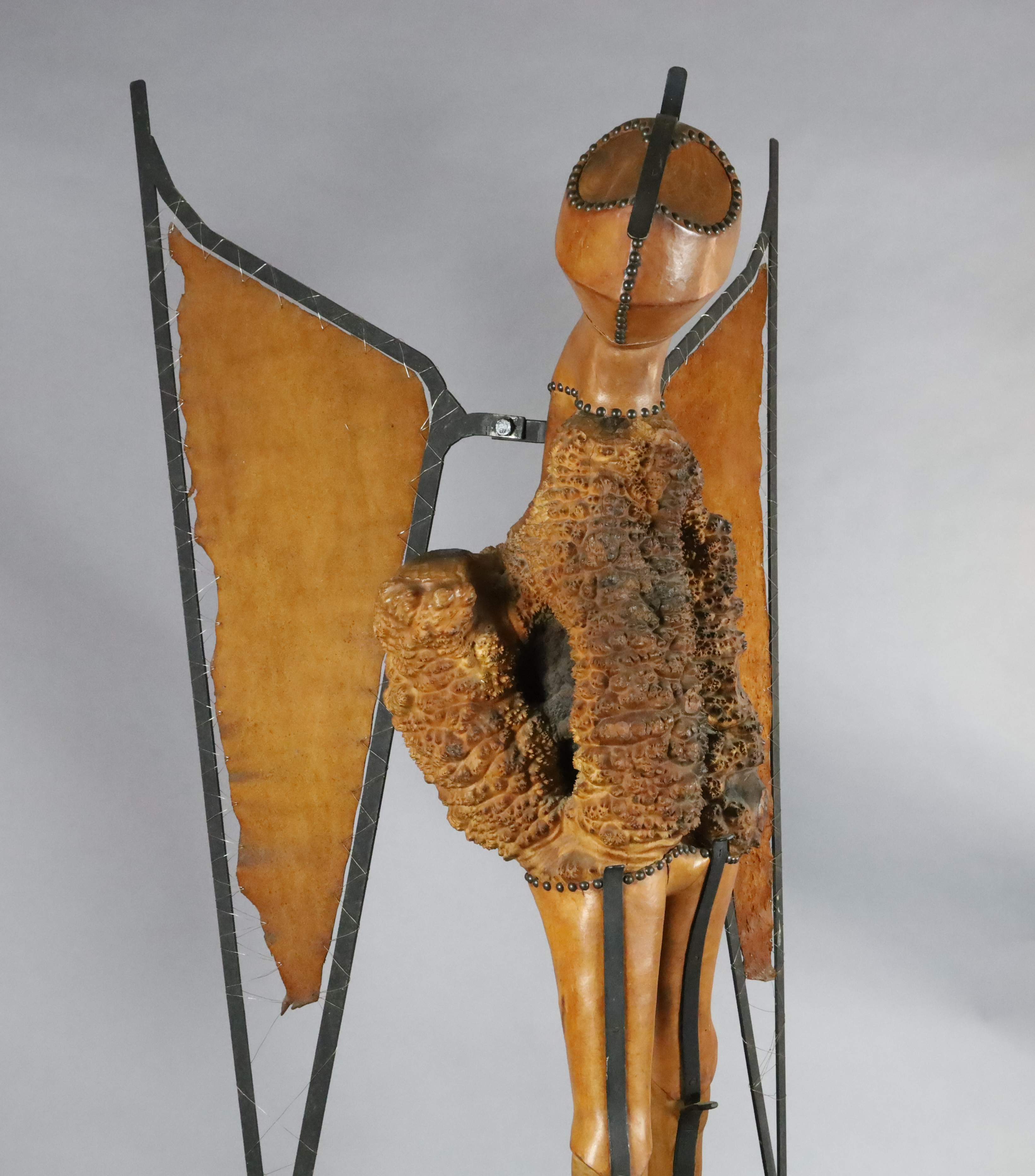 Maureen Langley (1931-) South African. wood, leather and wrought iron; Locust - the Arrogance of Man, H.6ft. W.35in.